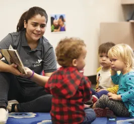 YMCA Louisville staff working with teen for babysitter training