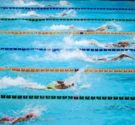 YMCA Louisville swim team members swimming laps