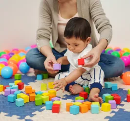 Baby playing with blocks