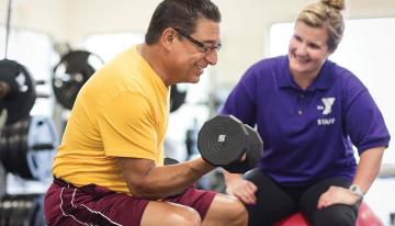 Man and instructor doing strength training at YMCA Louisville