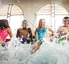 Children splashing at YMCA Louisville swimming pool